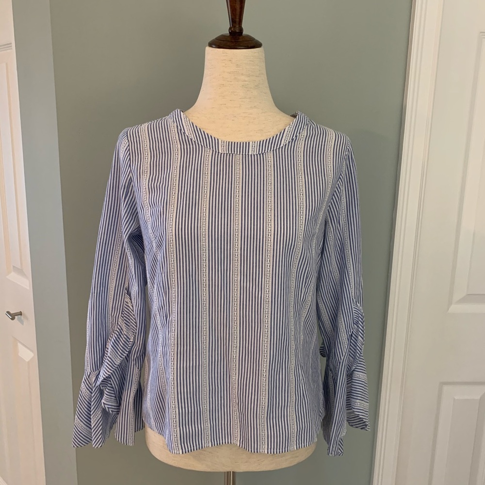Lightweight blue and white ruffle sleeve blouse.